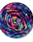 A circular canvas print featuring a vibrant, swirling galaxy design with a bright yellow center and cosmic swirls of blue, purple, pink, and orange, displayed on a clean white background.