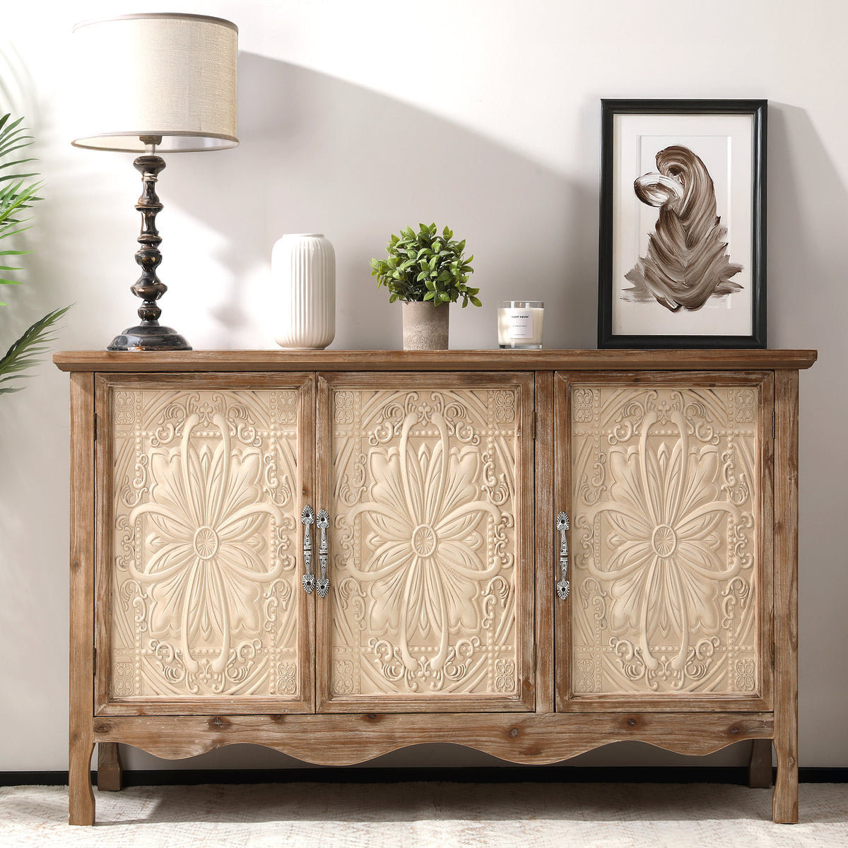 Natural wood Irim accent cabinet with cream carved doors, styled with a lamp