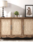 Natural wood Irim accent cabinet with cream carved doors, styled with a lamp