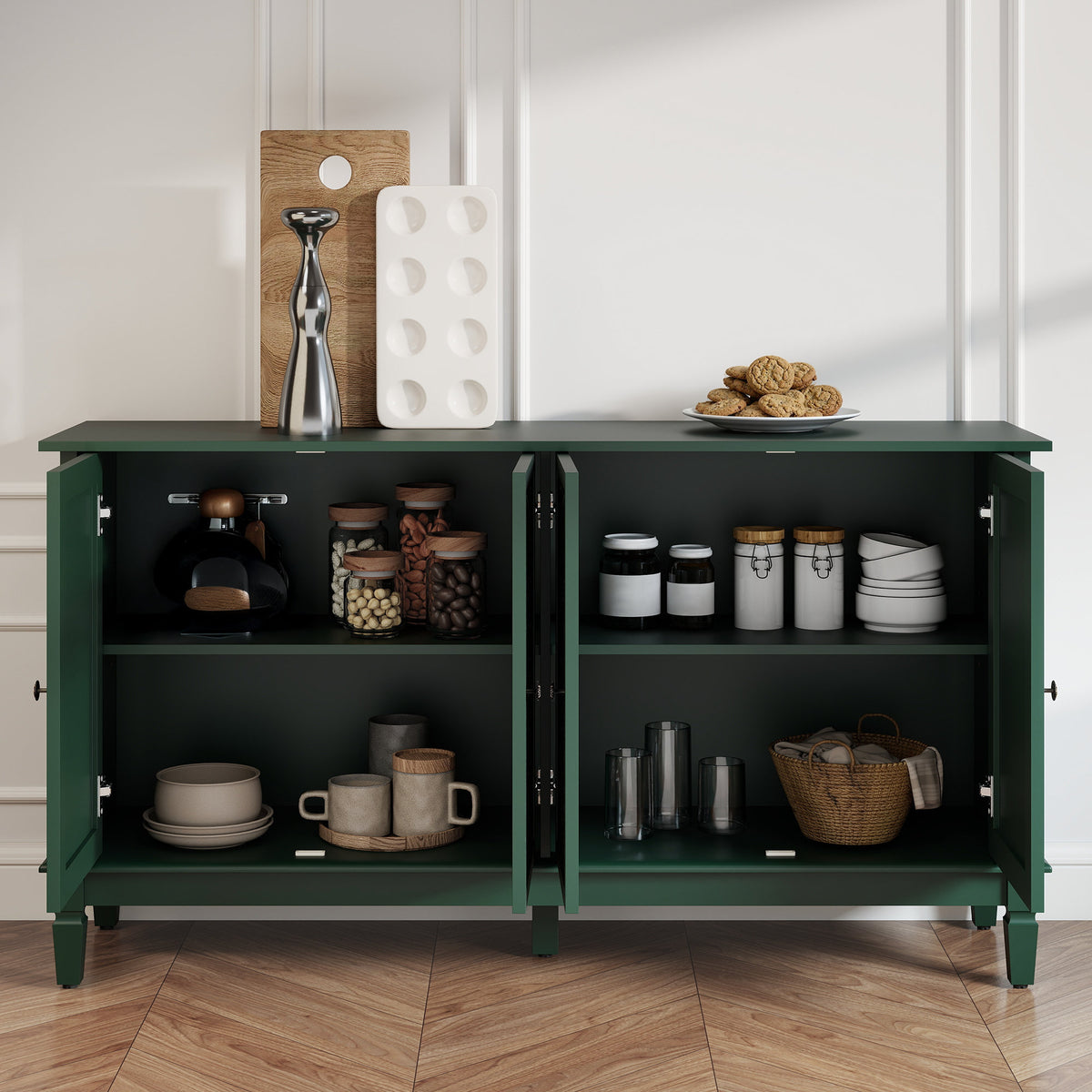 Green carved sideboard with all doors open showing storage