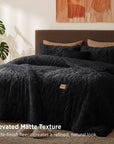 Black faux fur comforter with elevated matte texture