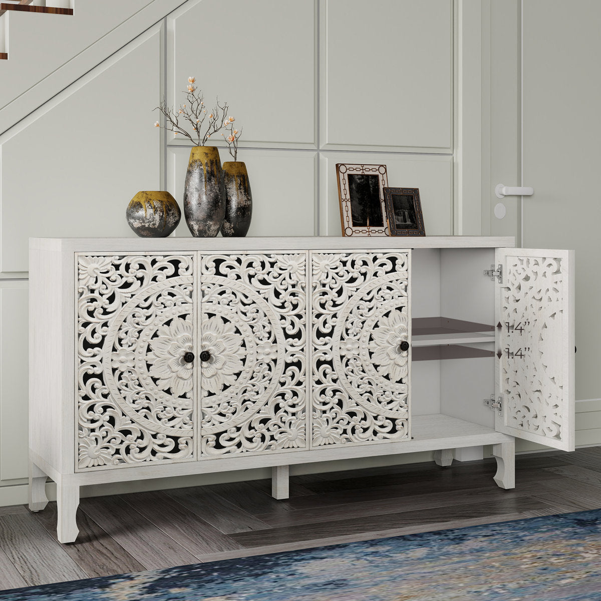 Carved white sideboard in an entryway with one door open