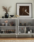Carved white sideboard with doors open showing adjustable shelves