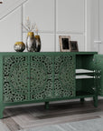 Carved green sideboard in an entryway with one door open