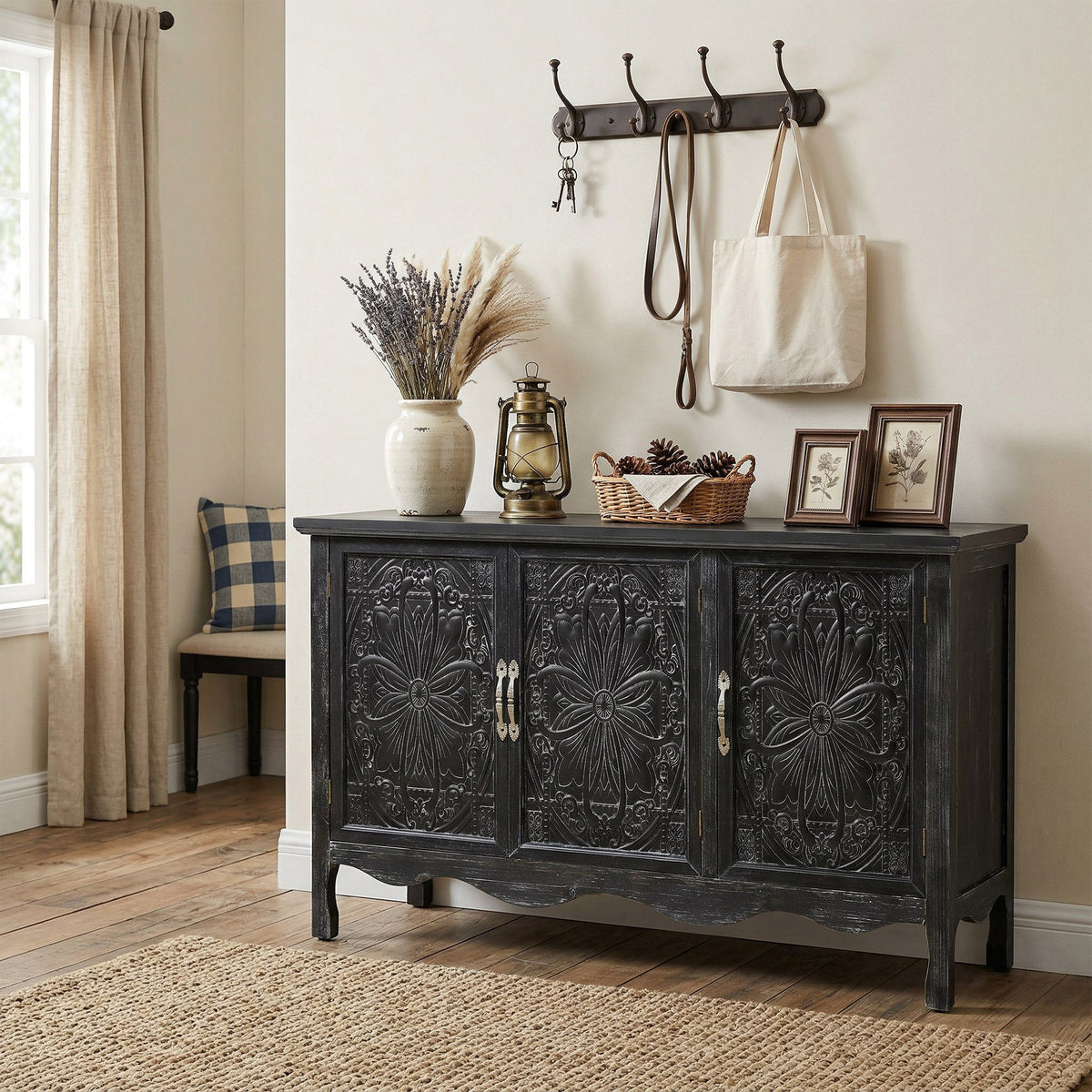Distressed black Irim accent cabinet in an entryway