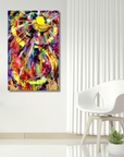 A colorful abstract canvas wall art print hanging on a white wall in a modern room setting with a white chair and a small potted plant.